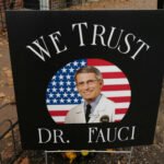 Fauci’s Top Expert REFUSED Vaccine—Career Destroyed… Sign reading We Trust Dr. Fauci on display.
