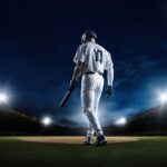 Mets Freefall Sparks “Mamdani Curse” Frenzy… A baseball player standing on the field at night, holding a bat