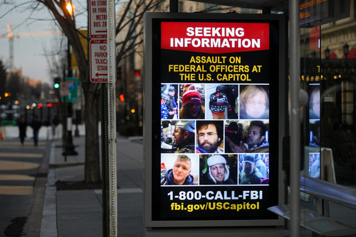 Billboard seeking information about individuals involved in an assault at the U.S. Capitol