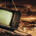 An old, broken television set in a desolate, post-apocalyptic landscape