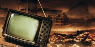 An old, broken television set in a desolate, post-apocalyptic landscape