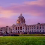 Minnesota State Capitol building at sunset with a colorful sky