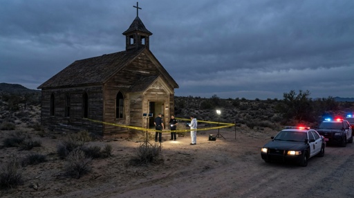 Police and forensic team at a crime scene near an abandoned church in the desert