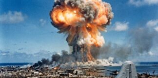 A nuclear explosion with a military aircraft in the foreground