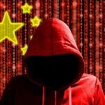 A hooded figure in a red hoodie against a backdrop of binary code and stars representing China