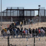 People waiting in line at border gate 40.