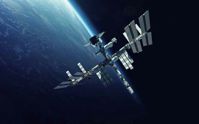 Space station orbiting Earth surrounded by dark sky.