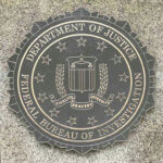 Jaw-Dropping FBI Numbers—But Where’s The Proof? Department of Justice, FBI seal on stone background.