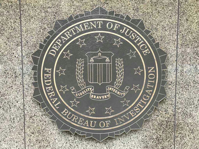 Department of Justice, FBI seal on stone background.