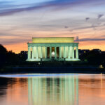 HIDDEN Fortress Under Lincoln Finally Opens…. Lincoln Memorial illuminated at sunset with reflection in water