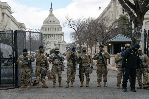 Washington,,D.c.,-,January,20,,2021:,National,Guard,Troops,And Armed soldiers standing guard outside the Capitol building