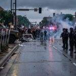 Curfew Chaos Erupts Outside ICE Lockup A tense standoff between law enforcement and protesters during a demonstration