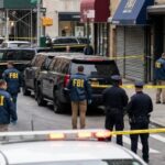 Border Policing Through Banks? FBI agents and police officers at a crime scene with police tape
