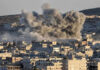 Toxic Haze Crashes World Cup Week Smoke rising from buildings in a city.