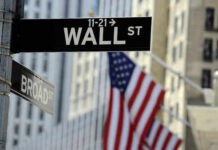 Tax-The-Rich Backfires—Billions Bolt Wall Street sign with American flag in background