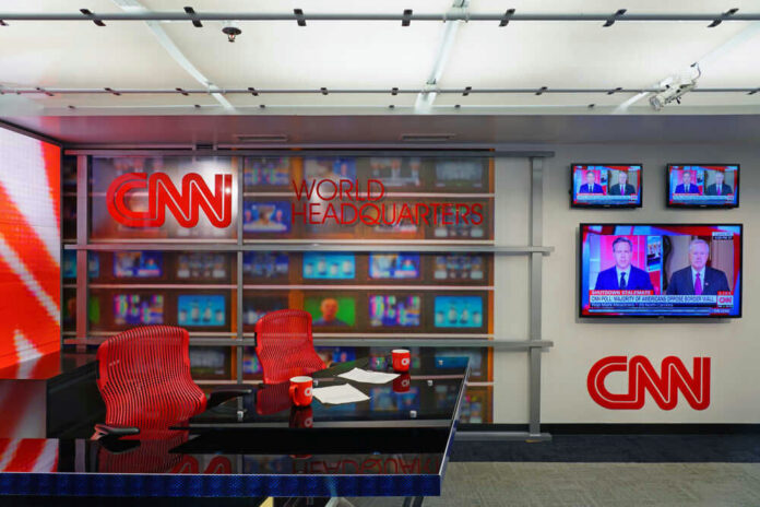 CNN World Headquarters studio with empty red chairs.
