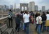 People walking on the Brooklyn Bridge, New York City.