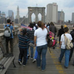 People walking on the Brooklyn Bridge, New York City.