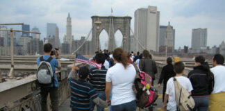 People walking on the Brooklyn Bridge, New York City.