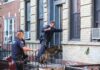 Homicide Unit Swarms Congresswoman’s Rental Police officers with a K-9 approach an apartment doorway