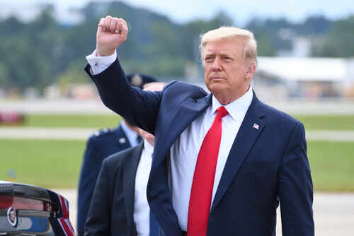 Marietta,,Ga-,September,25,,2020:,President,Donald,Trump,Gives,A A political figure raising a fist in a gesture of confidence during an outdoor event