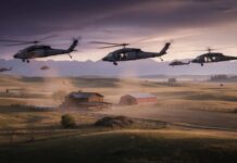 Black Hawks Blitz Camp—What Forced 202 Airlifts Military helicopters fly low over a rural farm at sunset