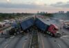 Undocumented Trucker, Three Dead—Light Sentence? Two overturned trucks blocking a highway with emergency responders at the scene