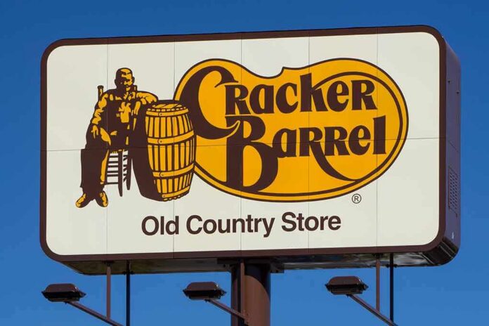 Cracker Barrel roadside sign with logo against blue sky