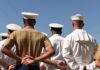 Six-Figure Bonus To Delay Retirement? sailors and marines standing in formation with hands behind backs