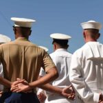 Six-Figure Bonus To Delay Retirement? sailors and marines standing in formation with hands behind backs