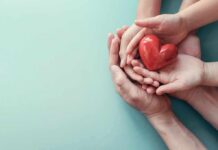 Hands holding a red heart