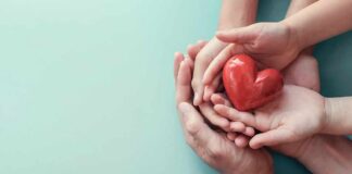 Hands holding a red heart