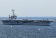 Aircraft carrier sailing at sea