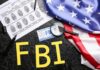 FBI letters with fingerprint sheet, badge, magnifying glass, and US flag