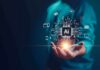 Apple Lawsuit Shadows OpenAI’s Home Companion Hand holding glowing AI chip with digital circuit icons
