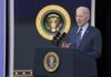 man in suit speaking at presidential podium