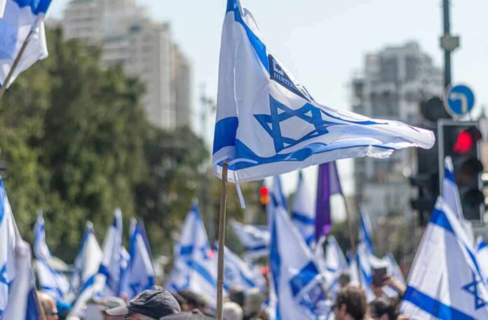 Israeli flags waved at a street demonstration