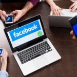 Kids’ Data Bombshell — Meta Folds Mid-Trial Laptop with Facebook on screen surrounded by smartphones