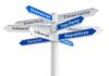 Directional signpost with multiple political party arrows