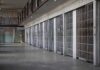 Execution Paused Over Abuse Bombshell prison cell block with metal barred doors