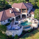 Malibu Sinkhole Traps Millionaires Luxury hillside stone mansion with tiered pool and spa