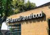 Planned Parenthood clinic exterior with sign on wooden facade