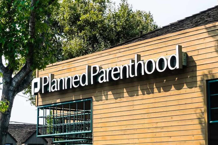 Planned Parenthood clinic exterior with sign on wooden facade