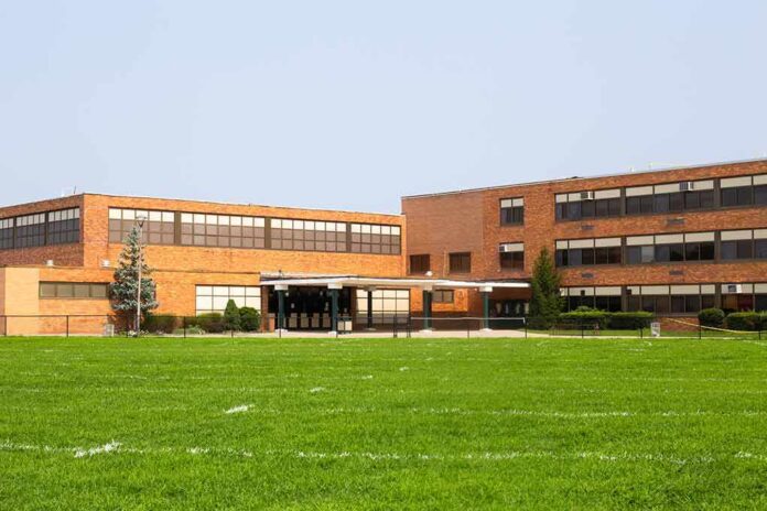 Brick school building with large windows and front entrance