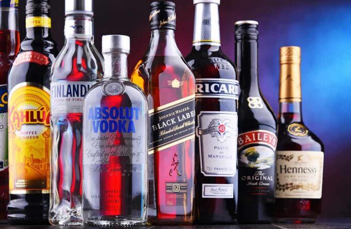 Assorted liquor bottles arranged in a row
