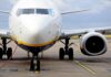 Passenger jet parked on tarmac front view