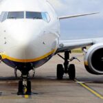 Passenger jet parked on tarmac front view