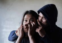 State Dept Flags Travel: Kidnapping Risk Added woman being restrained by a hooded person