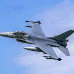 Fighter jet banking in the sky