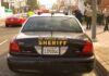 Sheriff patrol car parked on city street